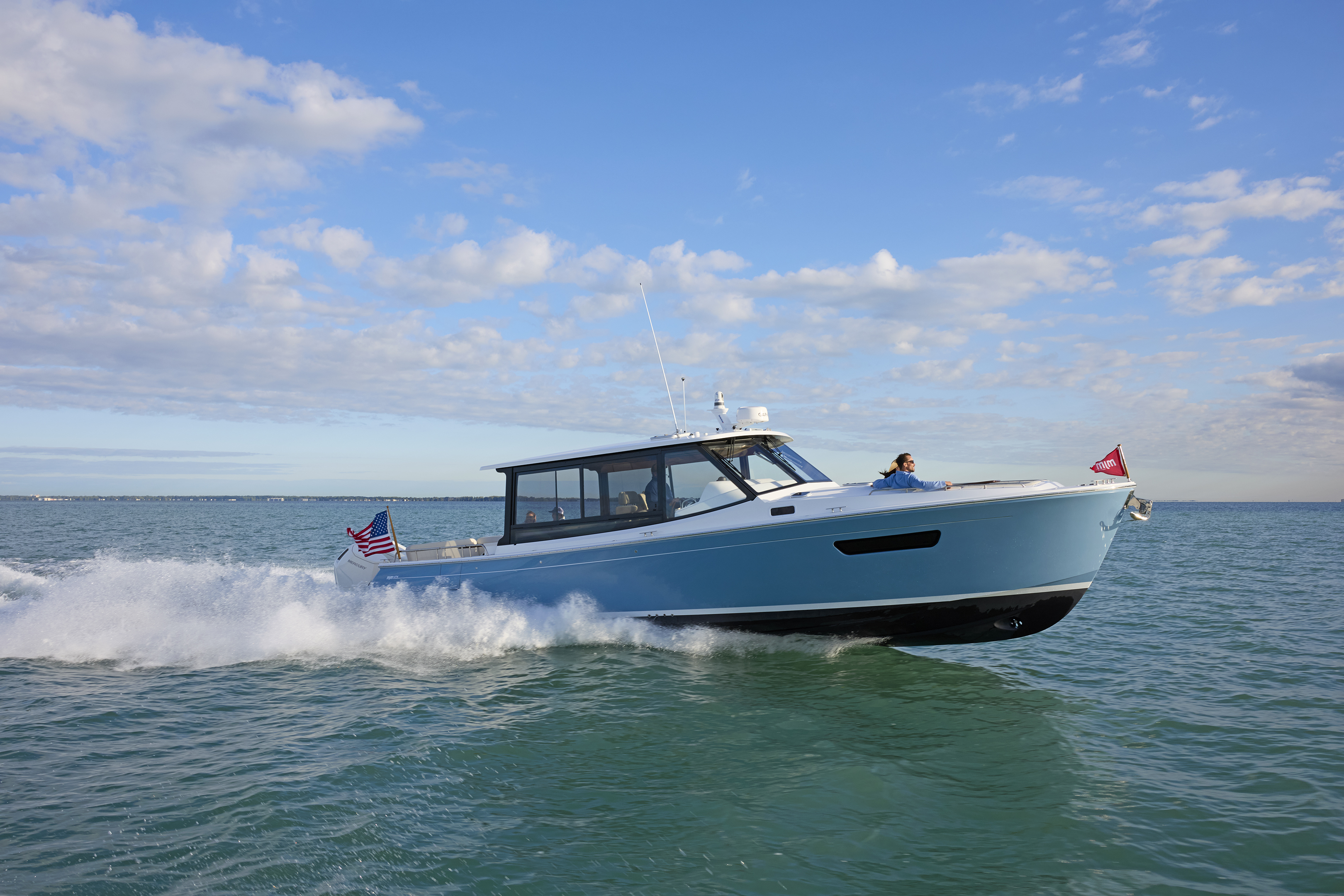 MJM 47X adventure day cruiser on the water